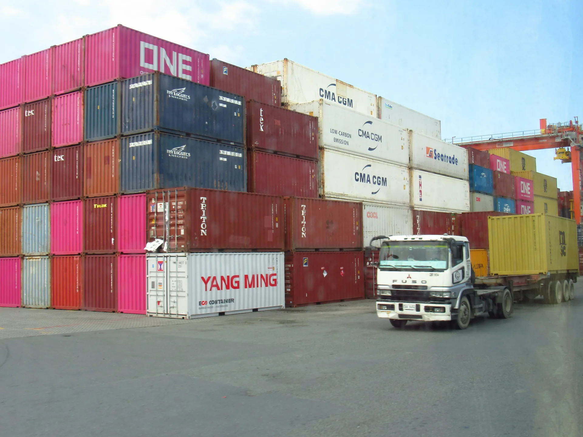 Shipping containers stacked at a freight terminal