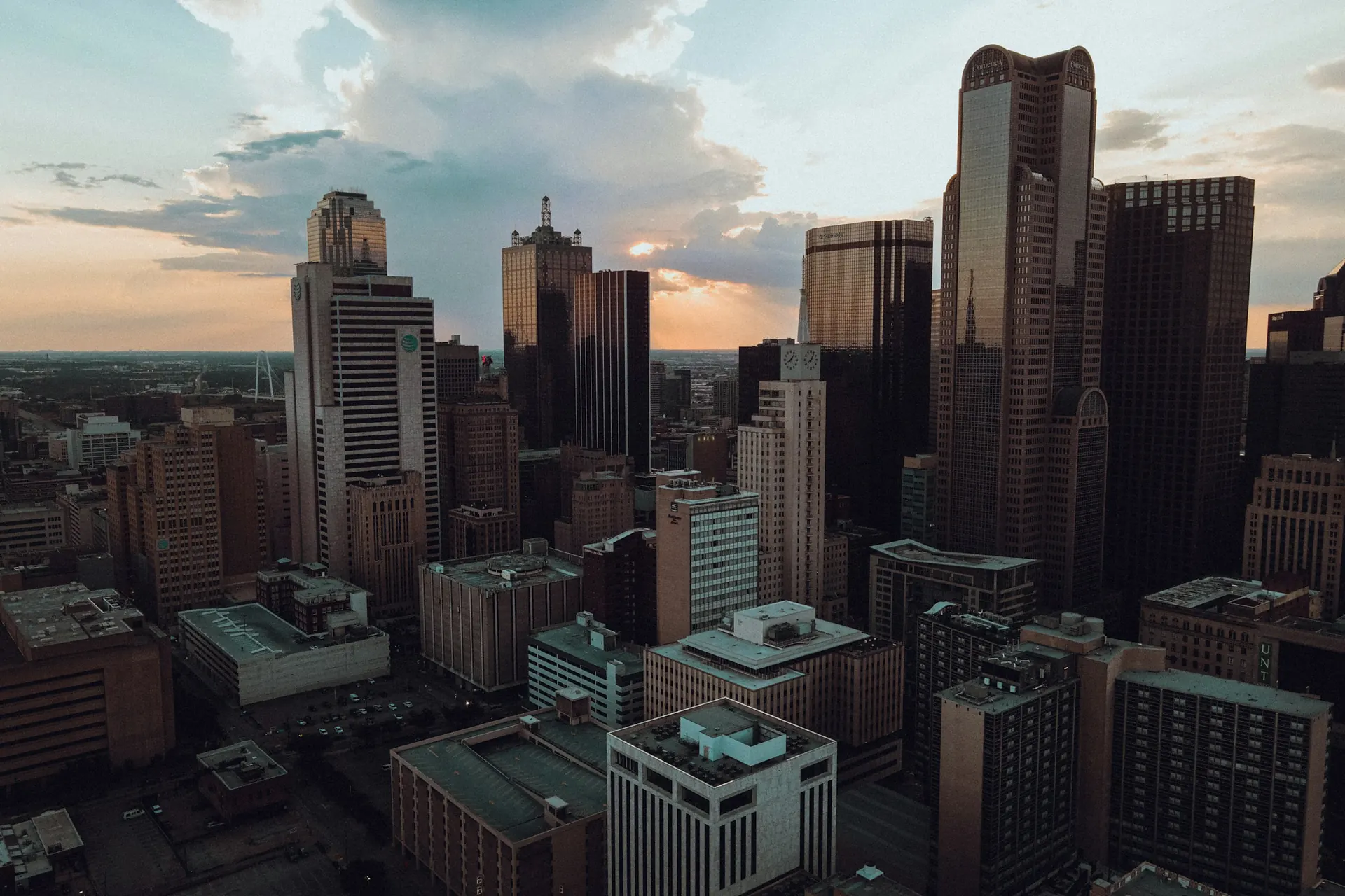 A United States city skyline at sunset
